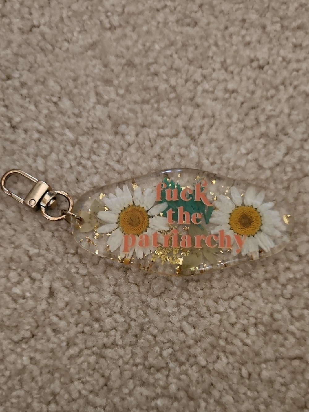 Taylor Swift "F*ck The Patriatarchy" Daisy Keychain - Clear with Gold Flakes
